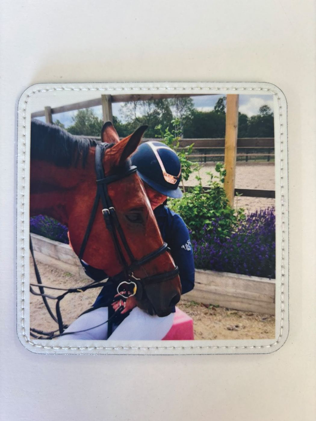 Coaster printed with a photo of a rider and her horse